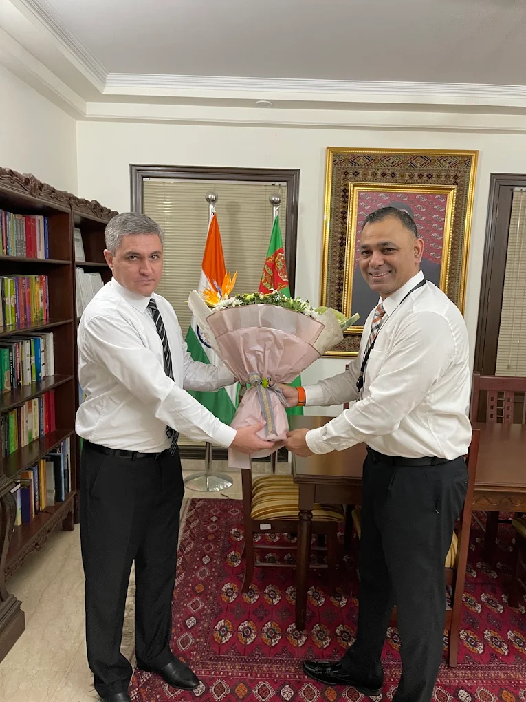 Amit Suden with a visiting diplomatic representative